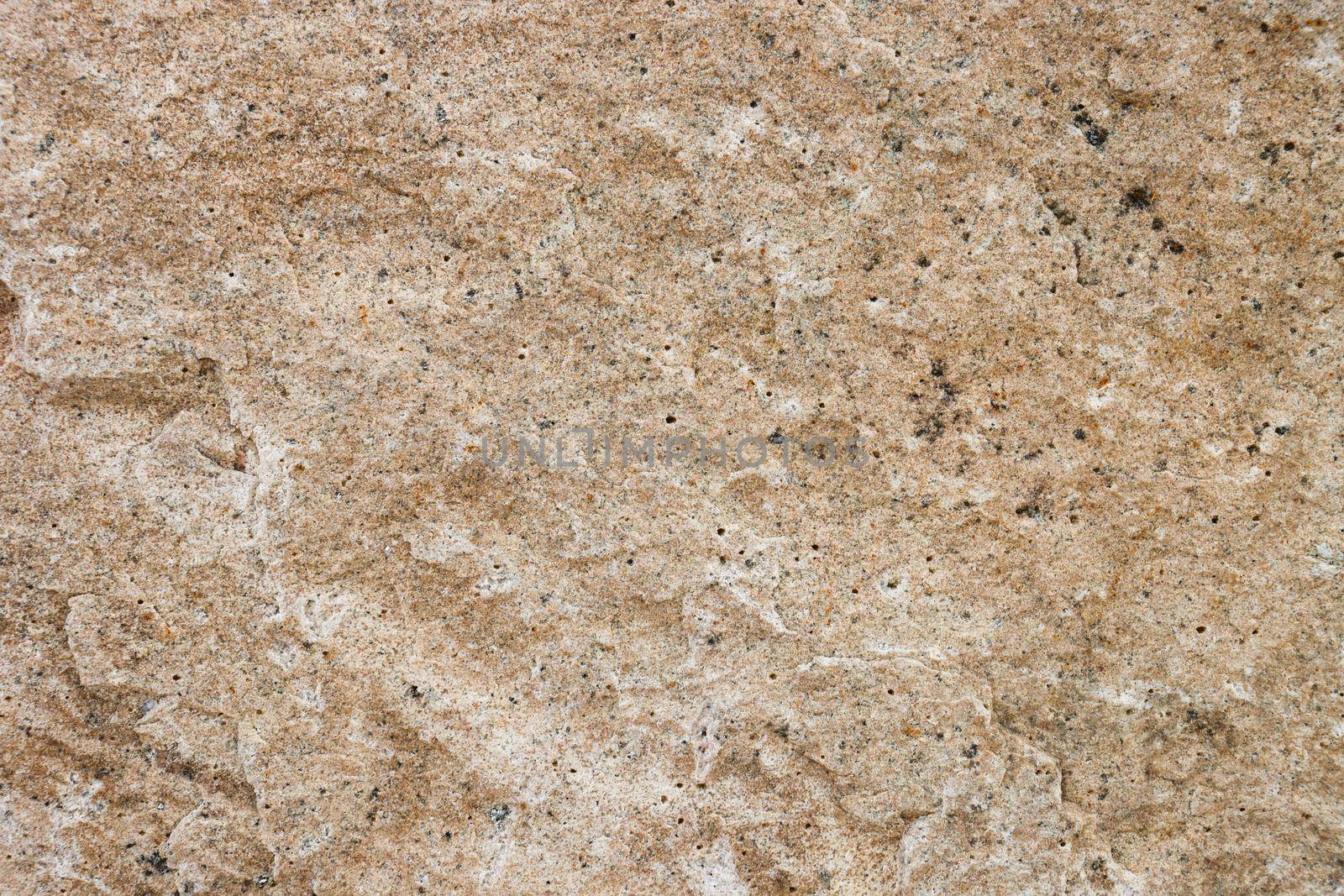 The texture of the granite stone surface in close-up. Texture for design with copy space.