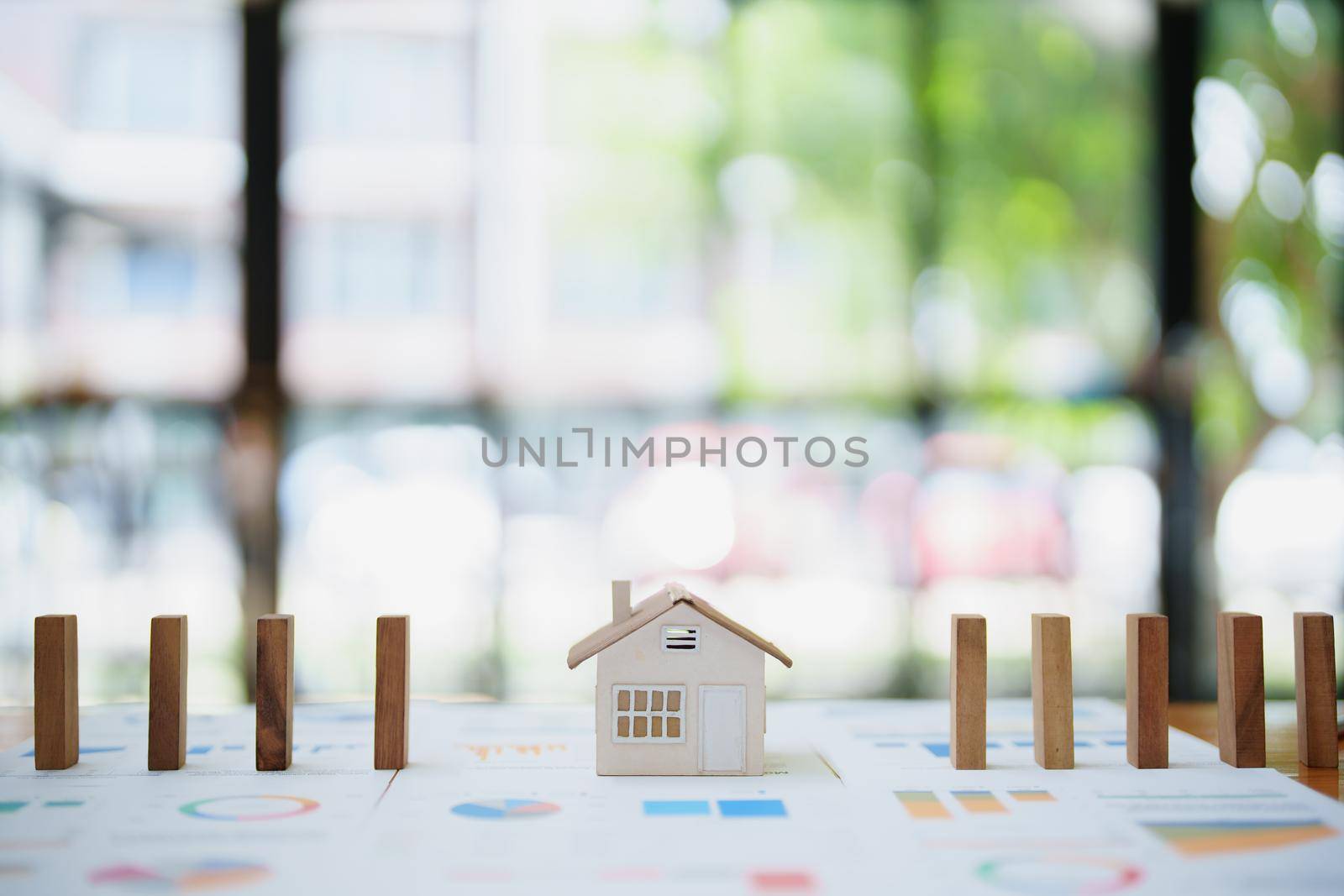 Model house and wooden stick, insurance concept by Manastrong