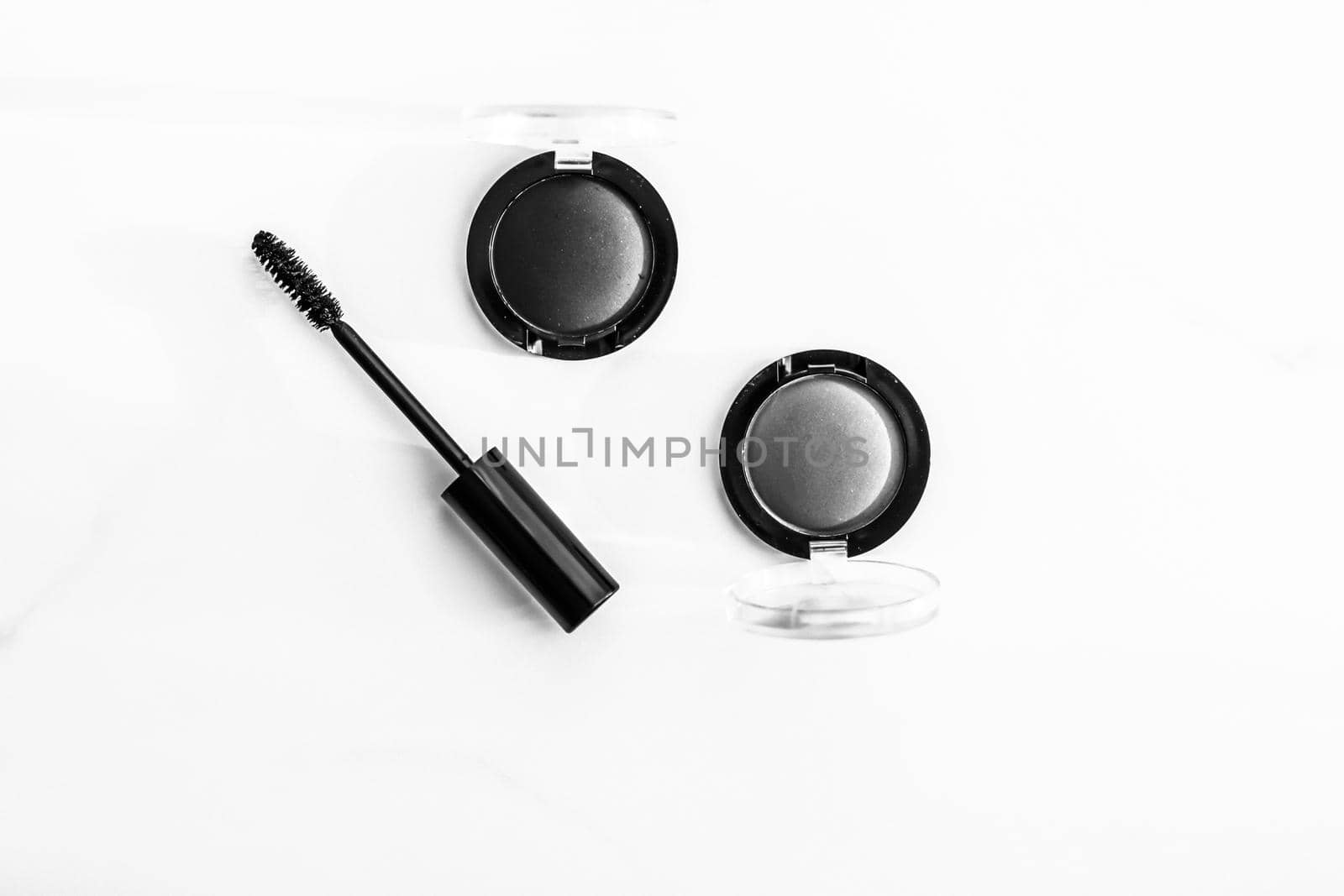 Cosmetic branding, blog and girly concept - Eyeshadows, black liner and mascara on marble background, eye shadows cosmetics as glamour make-up products for luxury beauty brand, holiday flatlay design