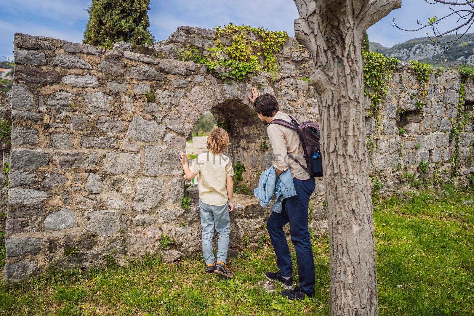 Dad and son tourists walks through the old town of Bar in Montenegro. Happy tourist walks in the mountains. Suburbs of the city of Bar, Montenegro, Balkans. Beautiful nature and landscape.