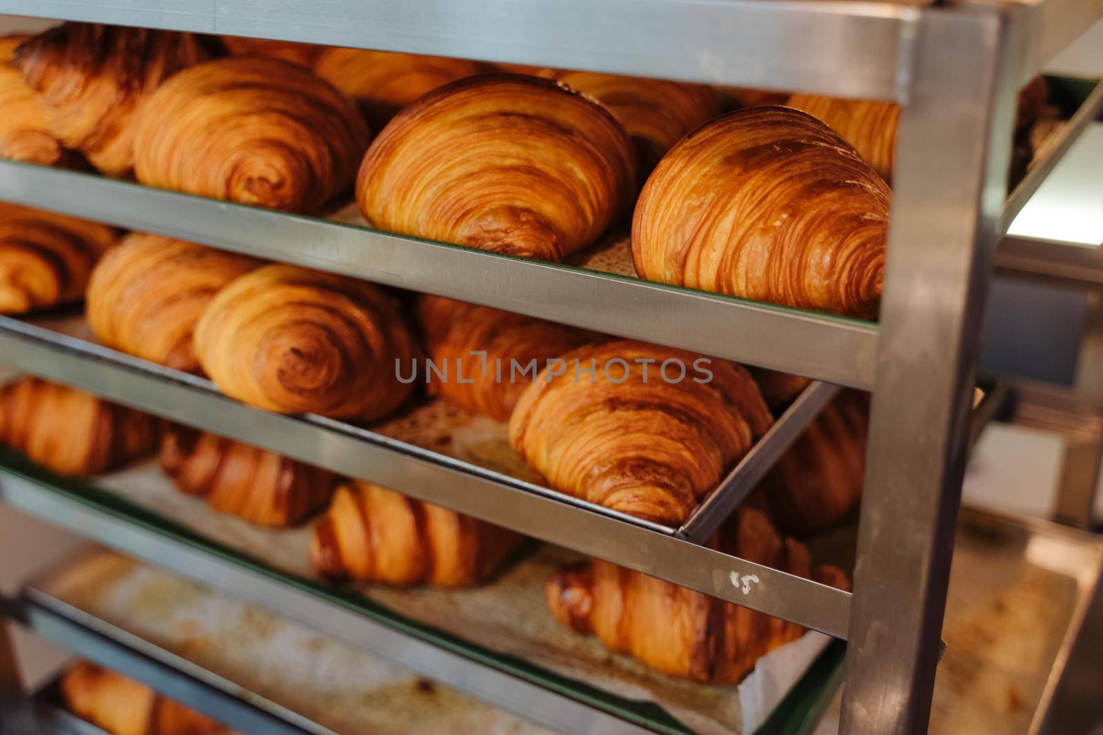 Bun production. Family bakery. Hot croissants only from the oven. Fresh bakery.