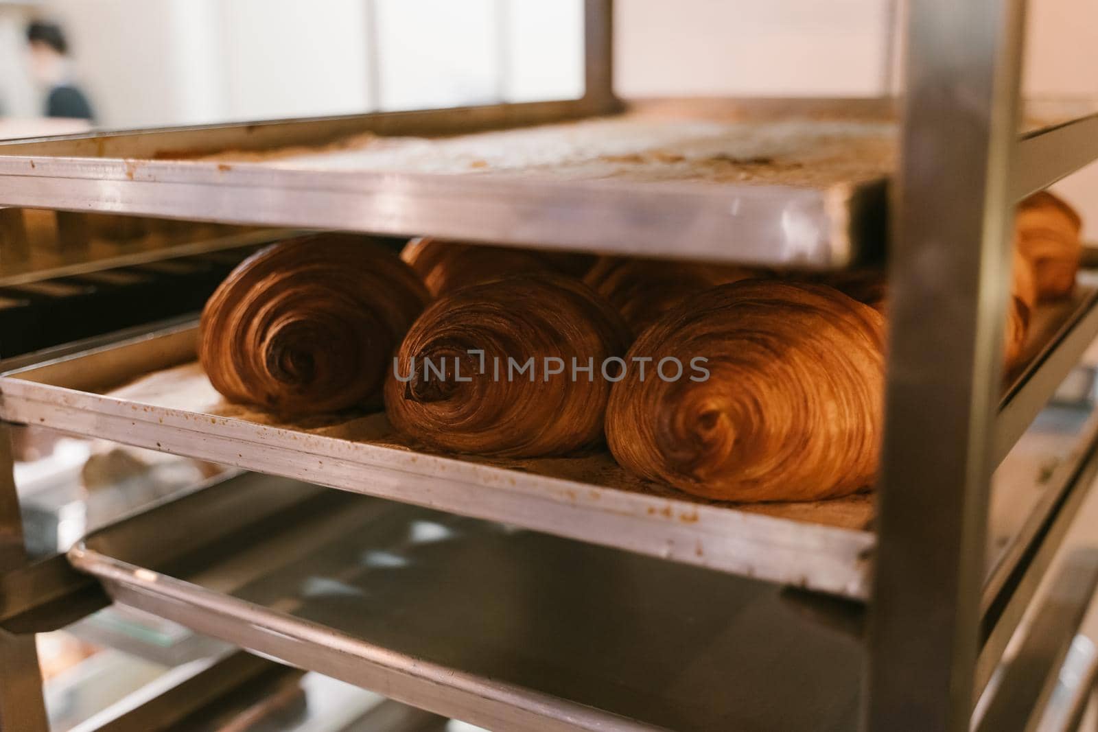 Hot croissants on a metal tray. Fresh bakery. Family bakery. by Rodnova