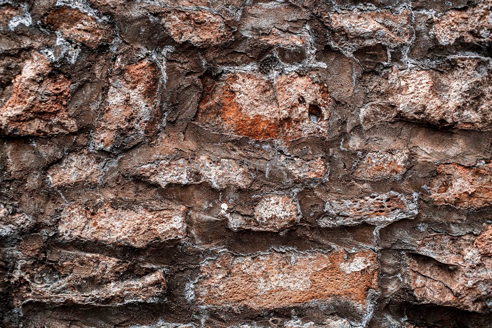 Natural old stone wall texture background with large stones.