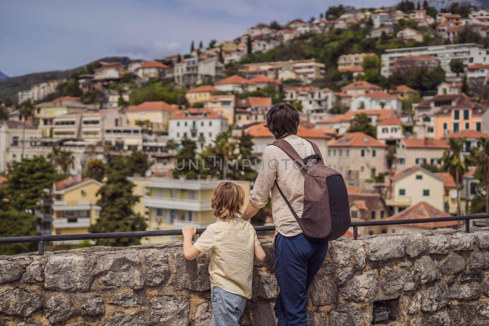 Father and son tourists in Herceg Novi old town. Historical and touristic center of Herceg Novi. Montenegro.