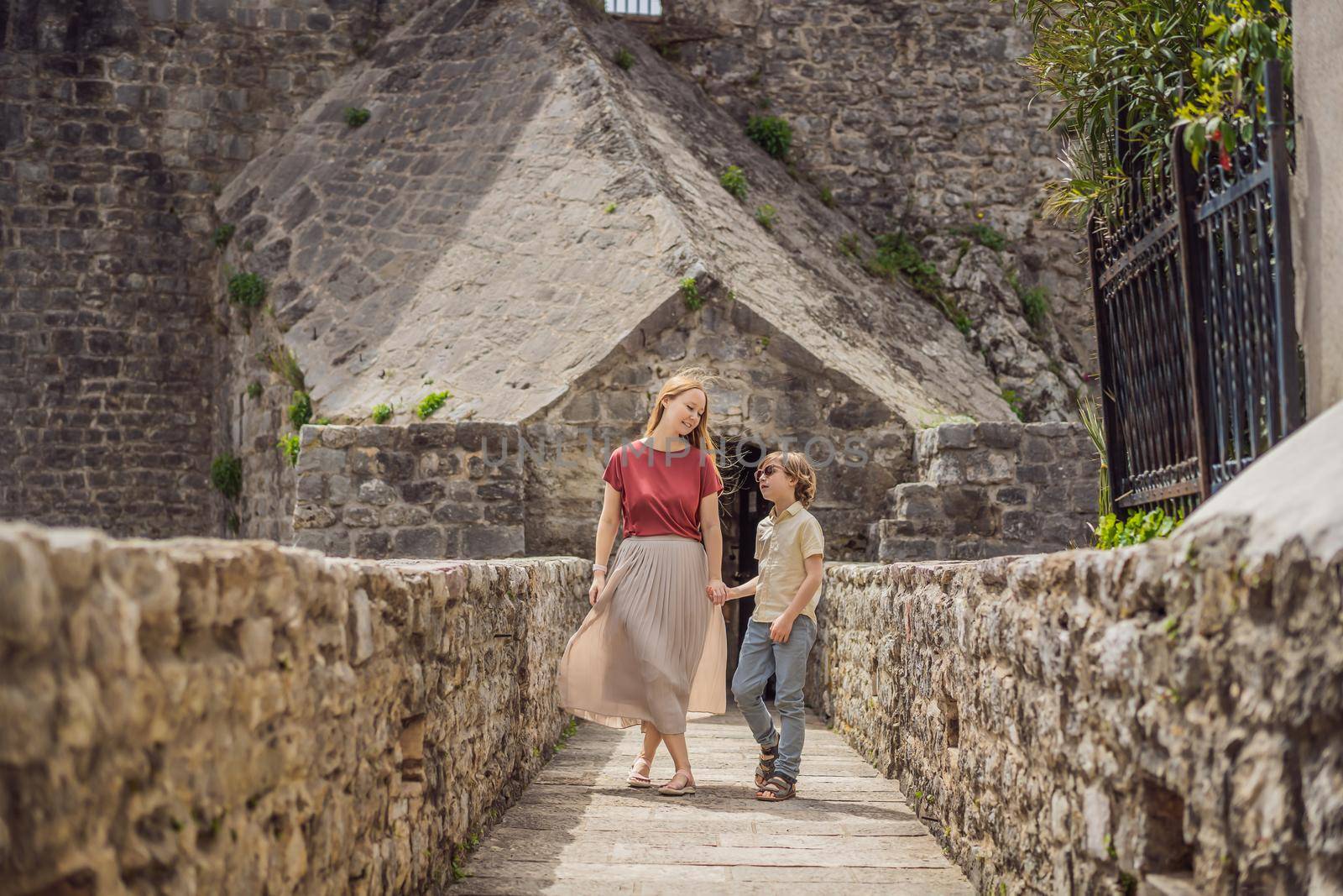 Mom and son tourists in Herceg Novi old town. Historical and touristic center of Herceg Novi. Montenegro.