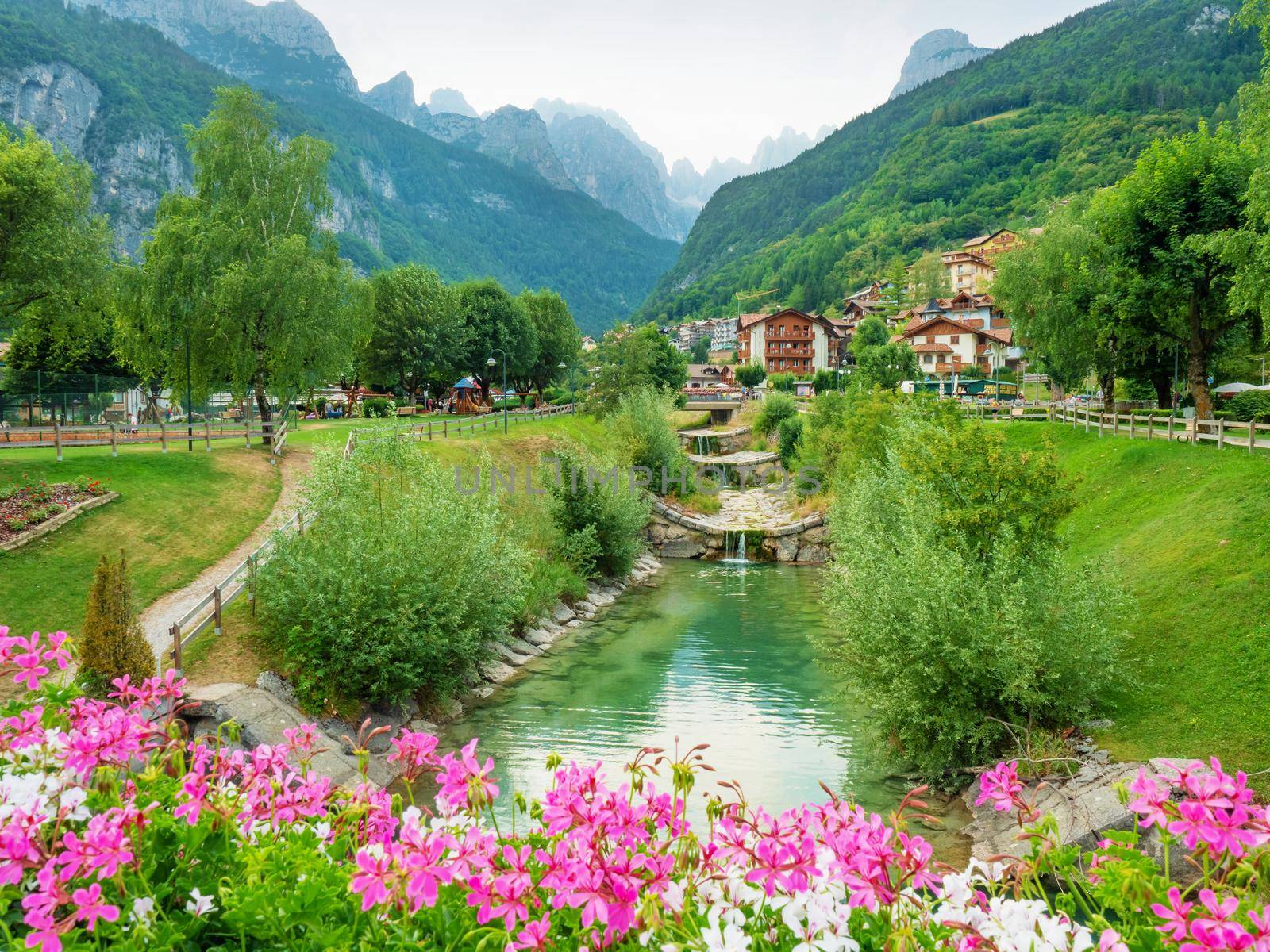 Moleno town and blue Molveno lake  at the foot of the Brenta Dolomites, western Trentino Alto Adige in Italy