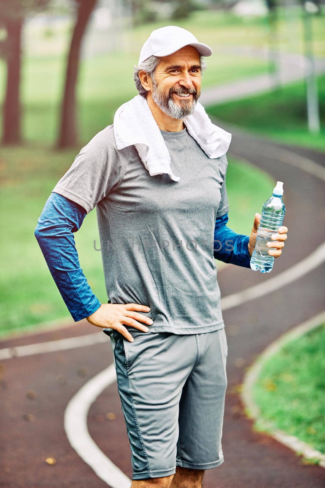 portrait of a senior man exercising and running outdoors