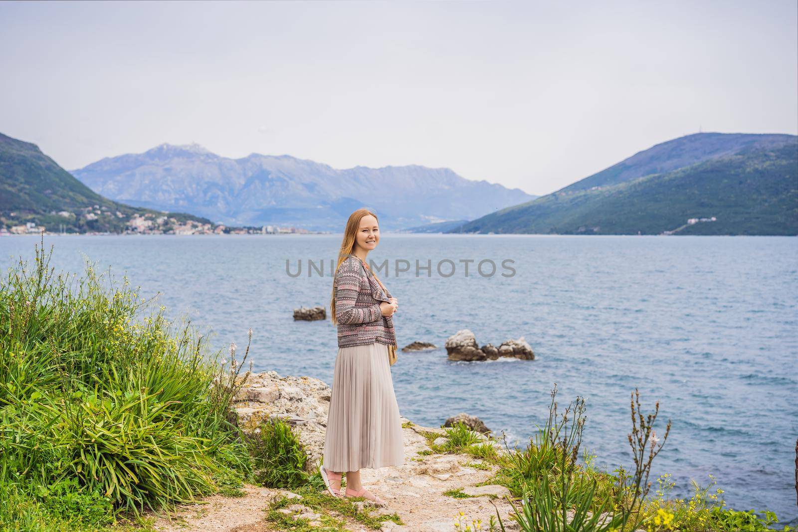 Woman tourist in Herceg Novi old town. Historical and touristic center of Herceg Novi. Montenegro.