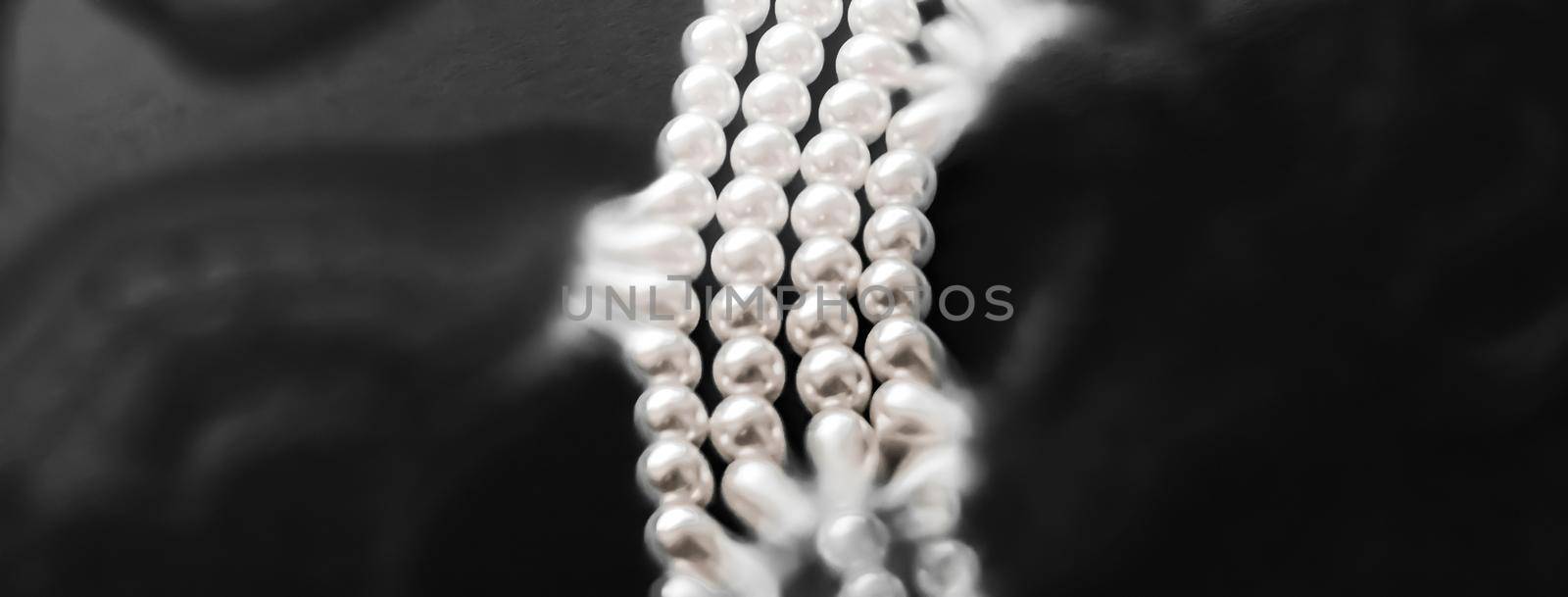 Jewelry, branding and gems concept - Coastal jewellery fashion, pearl necklace under black water background, glamour style present and chic gift for luxury jewelery brand, holiday banner design