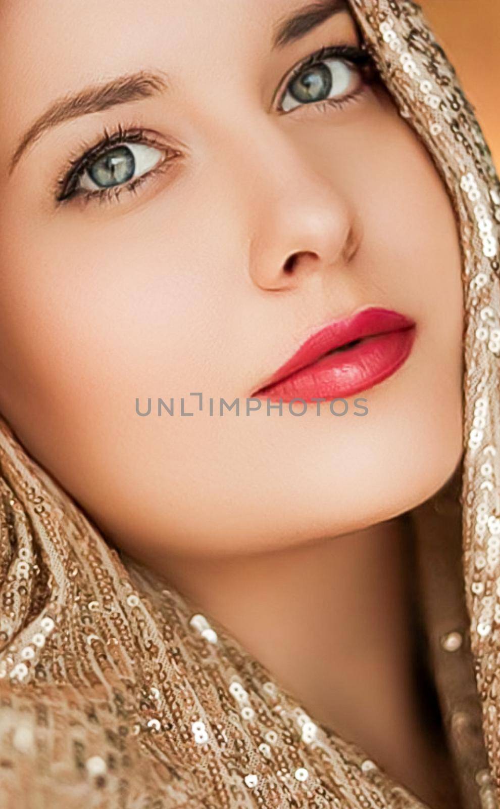 Beauty, luxury fashion and glamour, woman dressed in gold by Anneleven