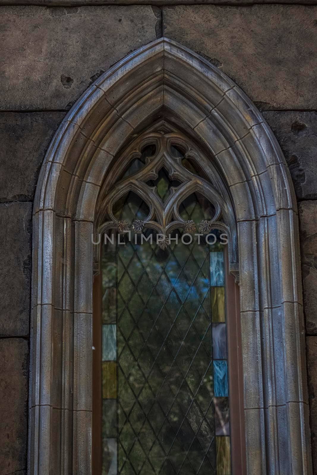 Antiquity in detail. Decoration of houses, balconies, windows, sculptures, walls. Elements of architectural design of buildings. Old plaster, Stone decorations. Elements of Gothic architecture.