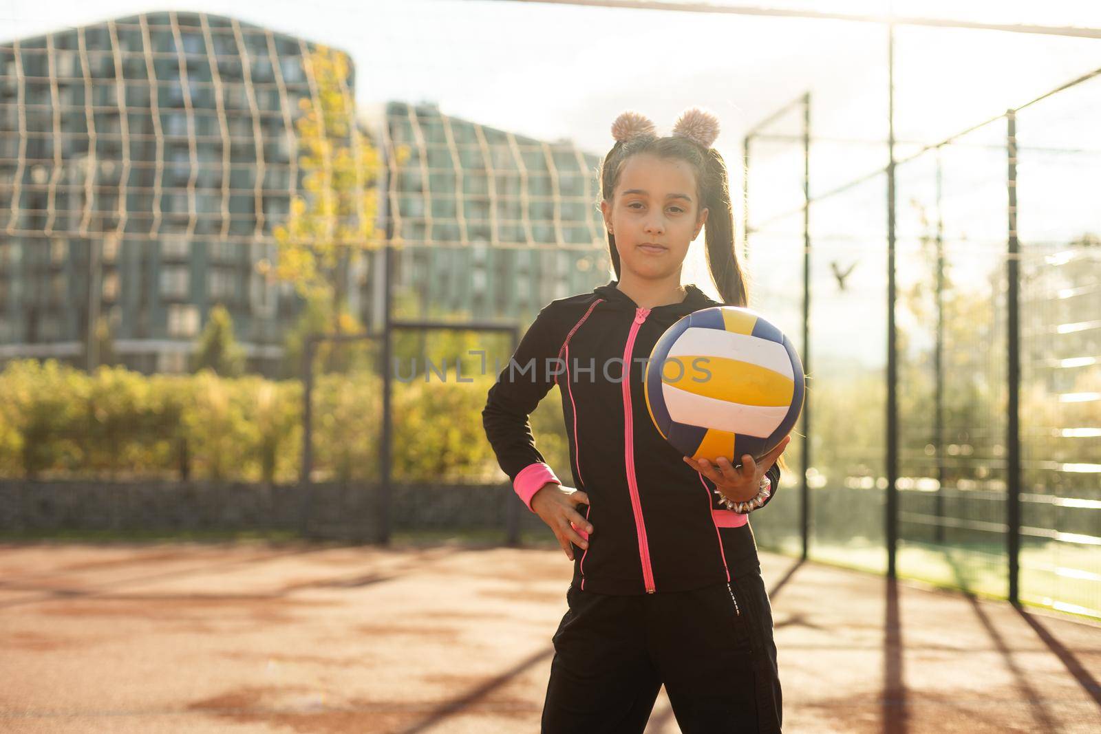 Pretty teen girl with brunette hair, volleyball ball by Andelov13