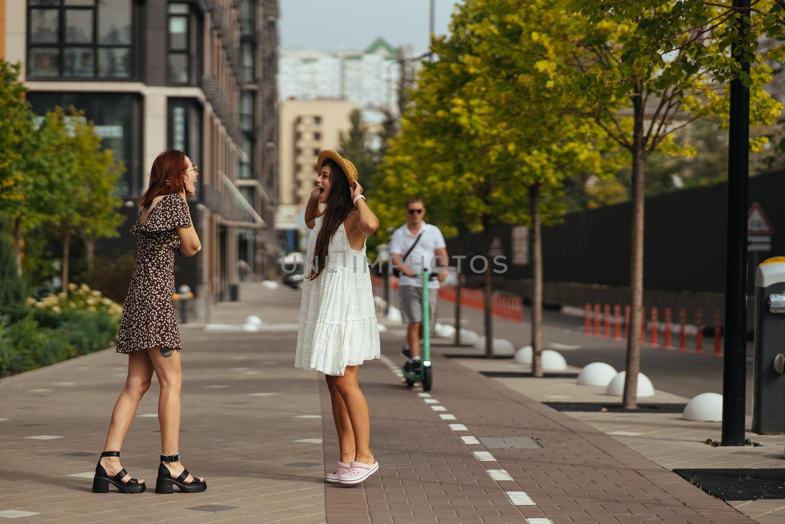 Meeting of two friends hugging in the street