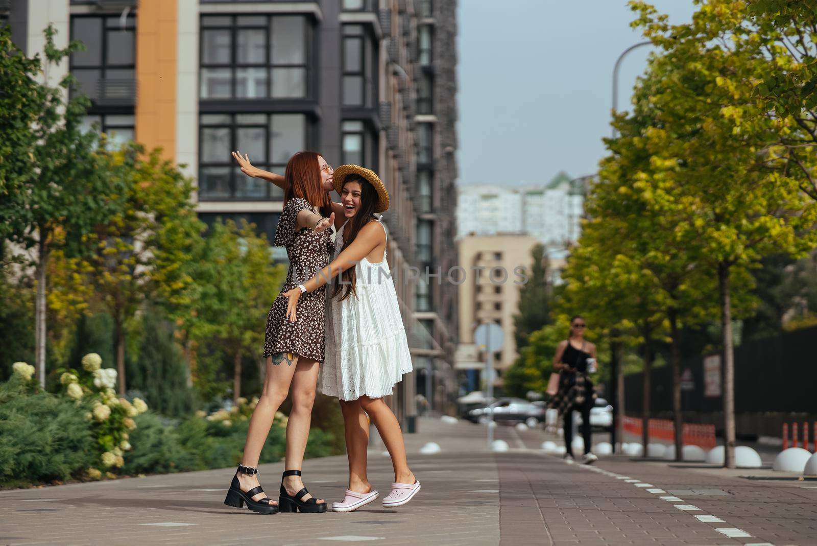 Meeting of two friends hugging in the street