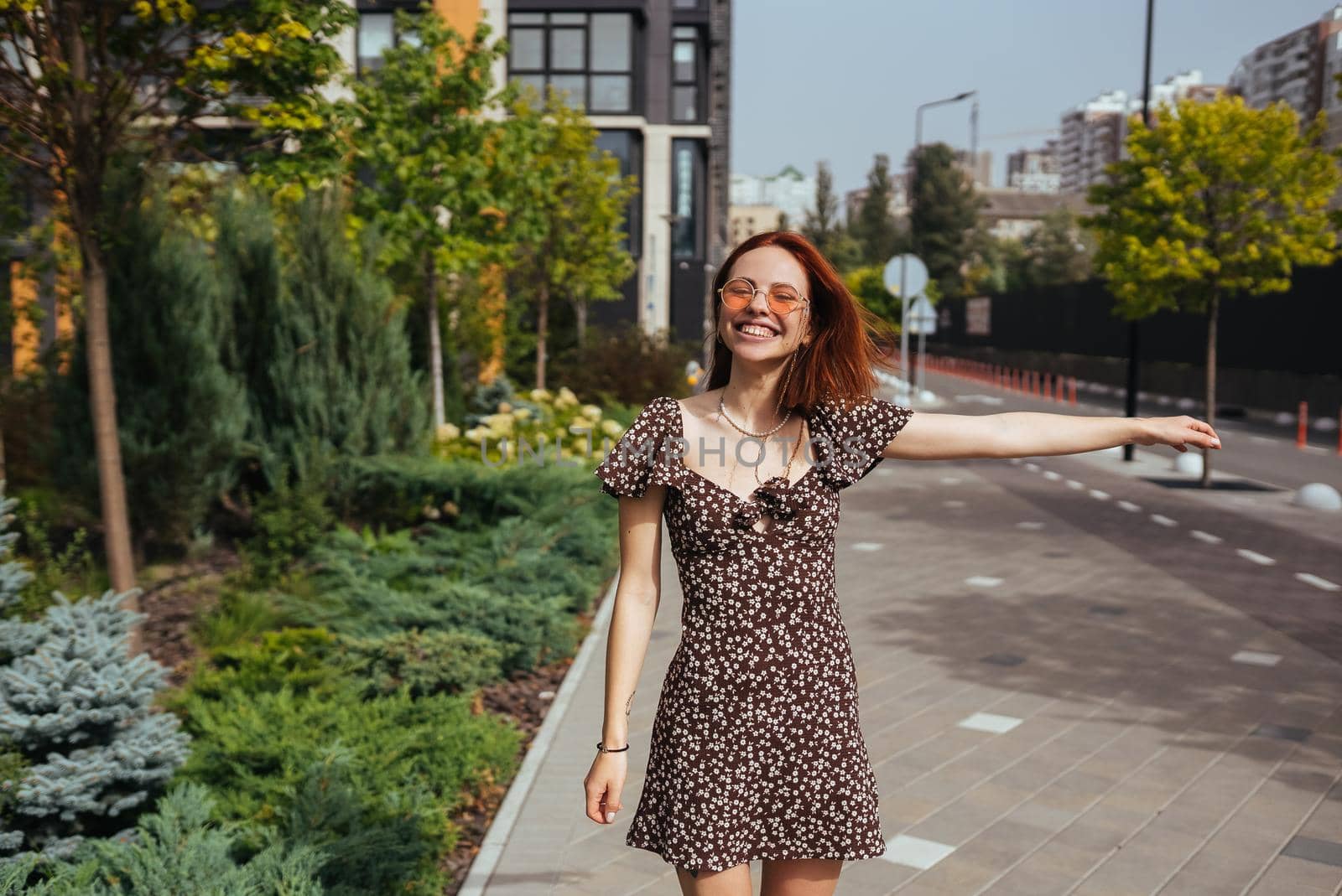 Fashion woman portrait of young pretty trendy girl posing at the city in Europe
