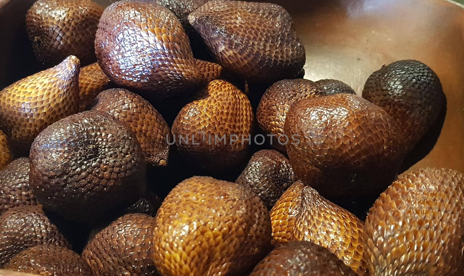 group of snake fruit or called salak in local indonesian language is a type of palm fruit commonly eaten also known as sala, the scientific name is Salacca zalacca.