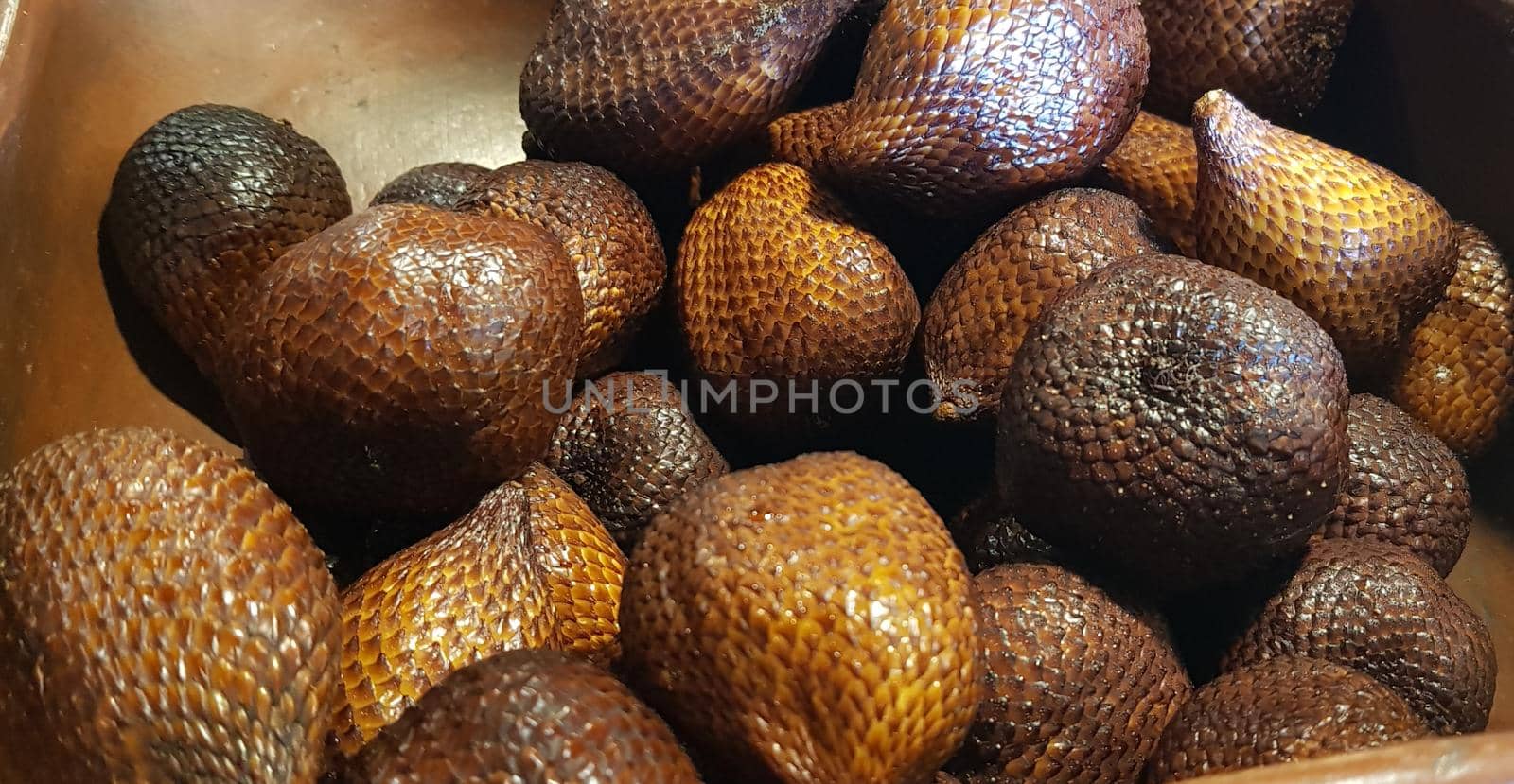 group of snake fruit or called salak in local indonesian language is a type of palm fruit commonly eaten also known as sala, the scientific name is Salacca zalacca.