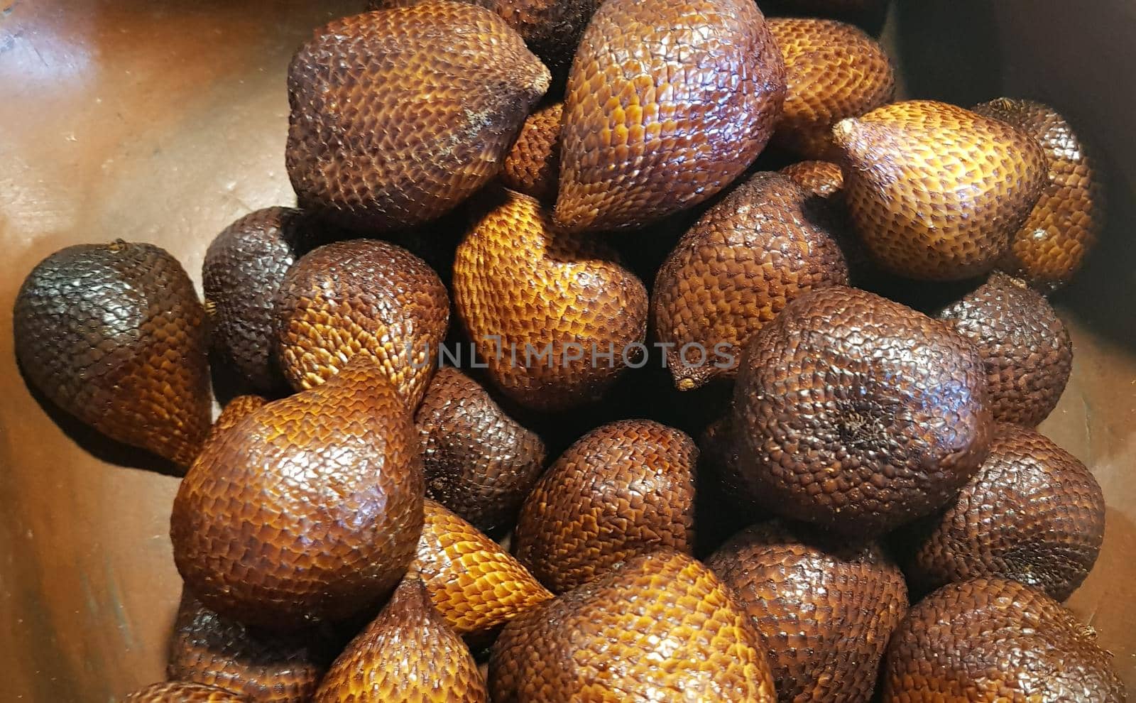 group of snake fruit or called salak in local indonesian language is a type of palm fruit commonly eaten also known as sala, the scientific name is Salacca zalacca.