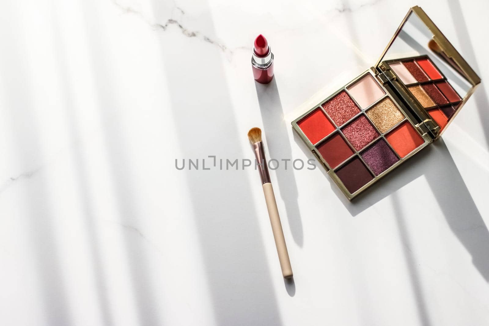 Cosmetic branding, girly and glamour concept - Cosmetics, makeup products set on marble vanity table, lipstick, eyeshadows and make-up brush for luxury beauty and fashion brand ads, holiday design