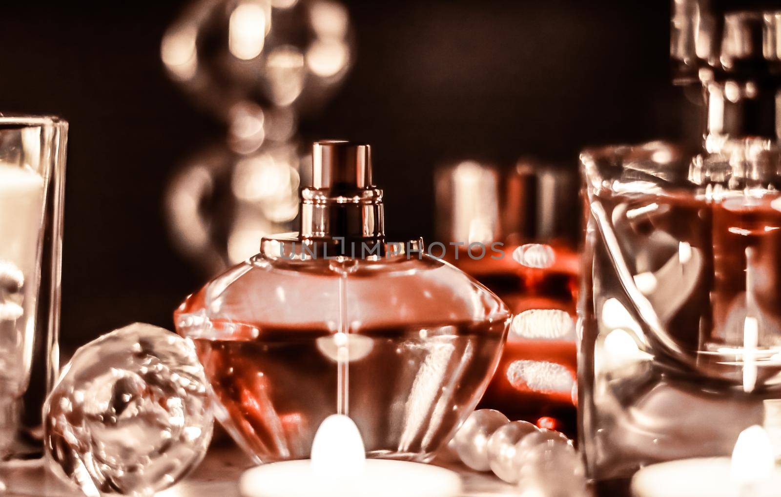 Perfumery, cosmetics branding and luxe concept - Perfume bottle and vintage fragrance on glamour vanity table at night, pearls jewellery and eau de parfum as holiday gift, luxury beauty brand present