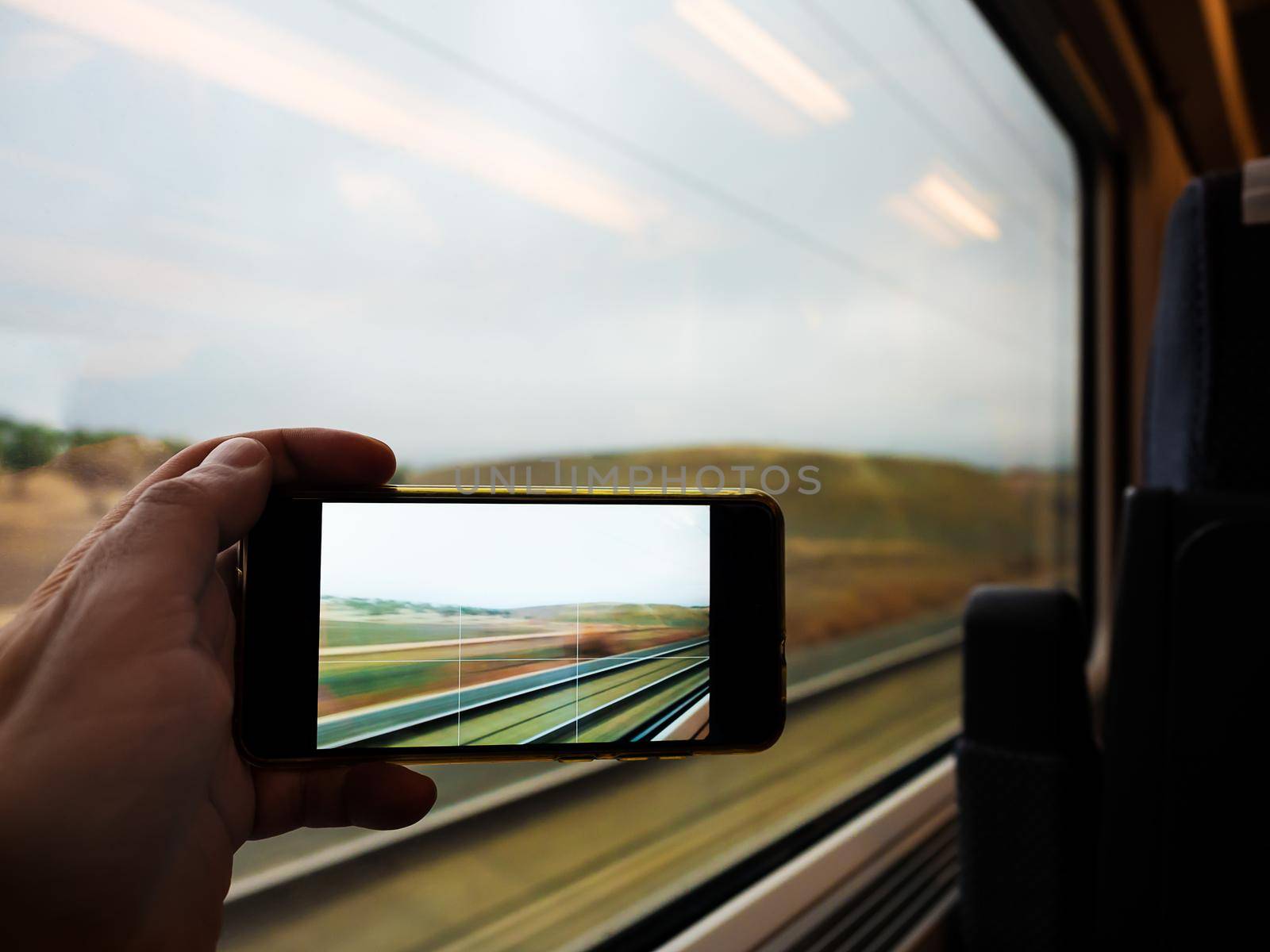Taking photo through the window of the train by raulmelldo