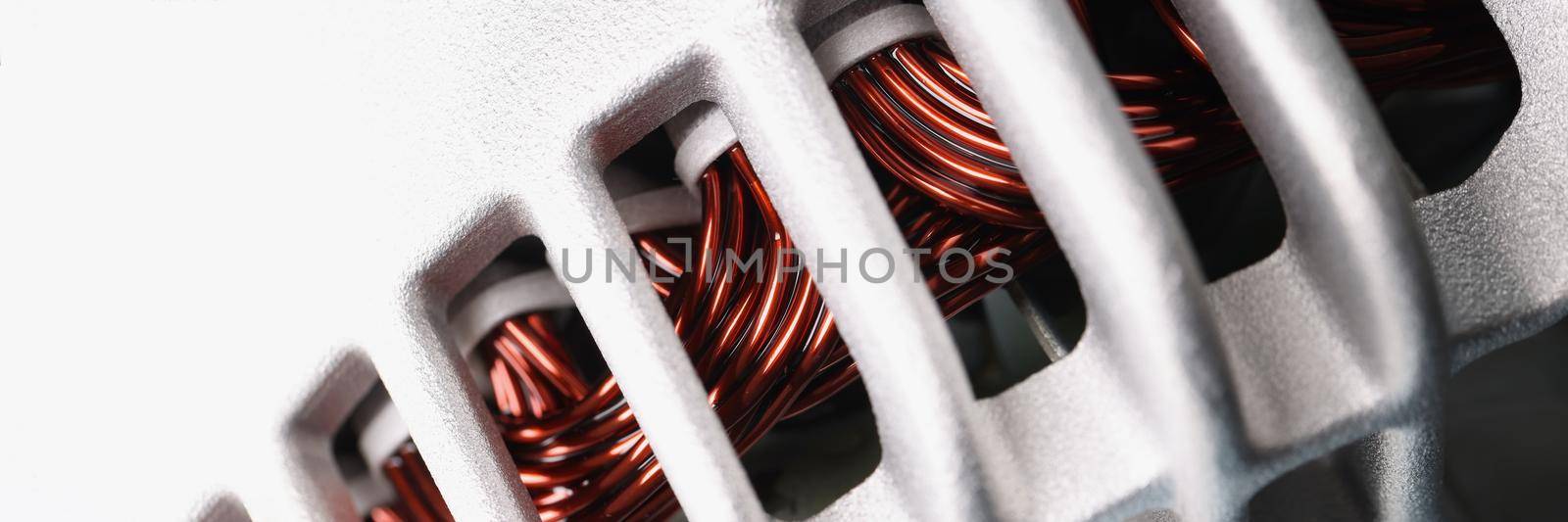 Close-up of electric motor stator with winding coil, view of inside of electric induction motor under repairing, armature detail. Fix, repair, part concept