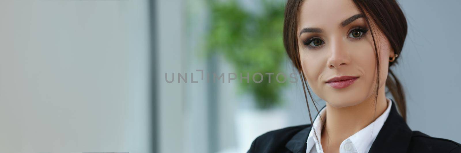 Beautiful smiling clerk wear suit hold notebook at workplace, look in camera by kuprevich