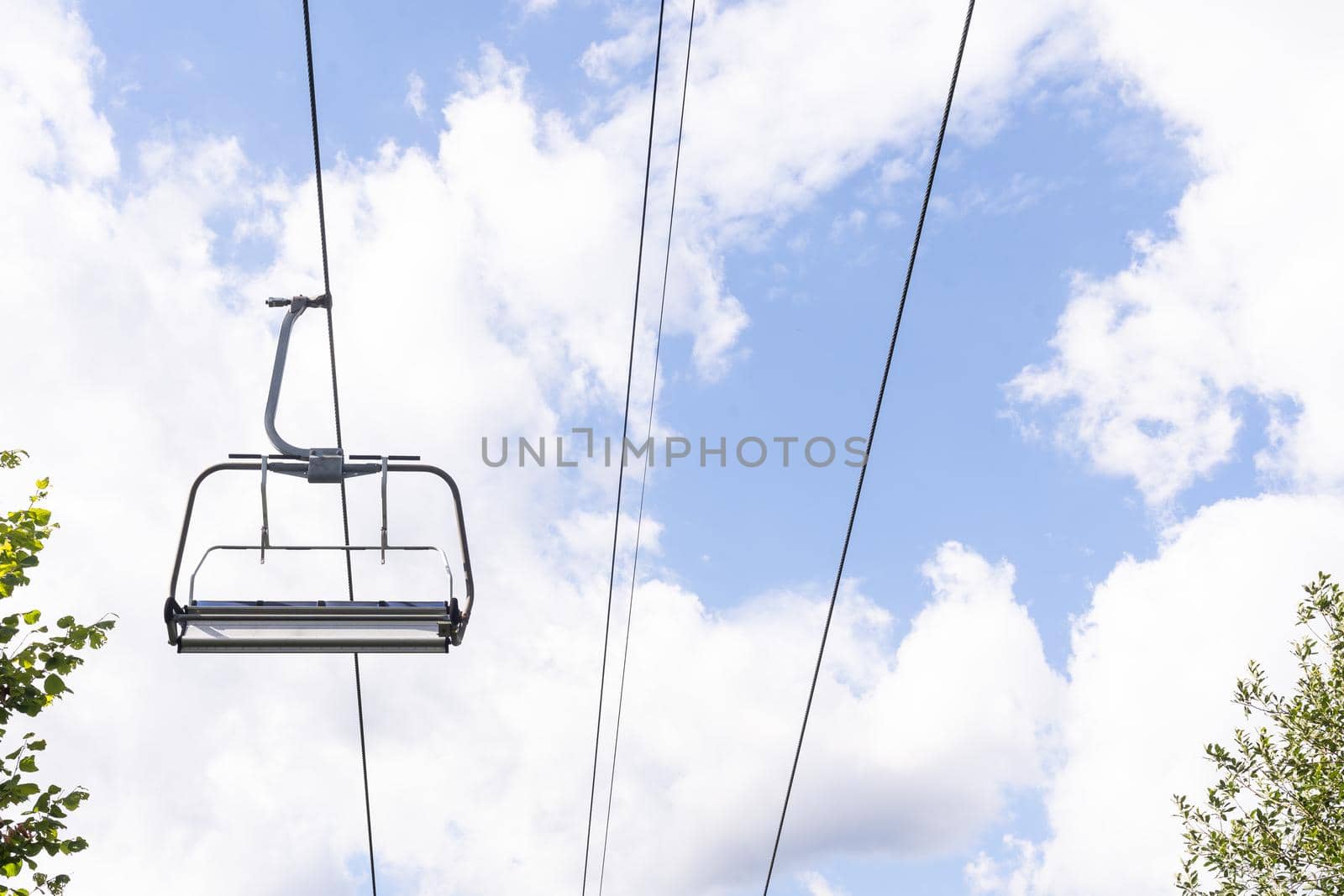 Mountain lift on sky background. Empty space for text by Andelov13