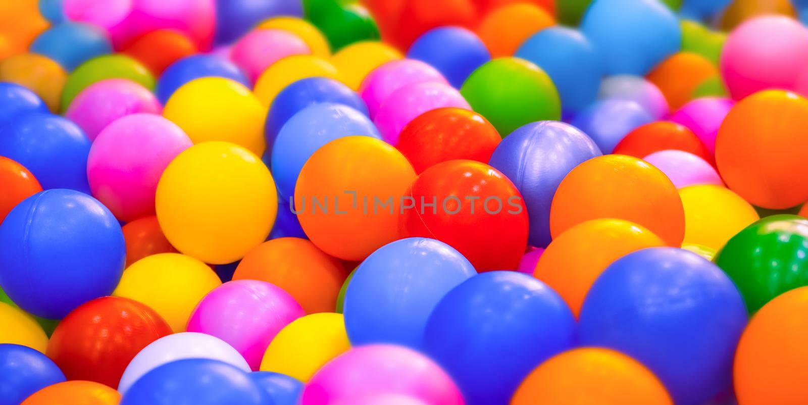 Dry pool or kids ball pit. Many colorful balls background playground balls pool plastic. Entertainment banner kids play zone or kids zone. Kindergarten playground indoor play area. leisure. Playroom by synel