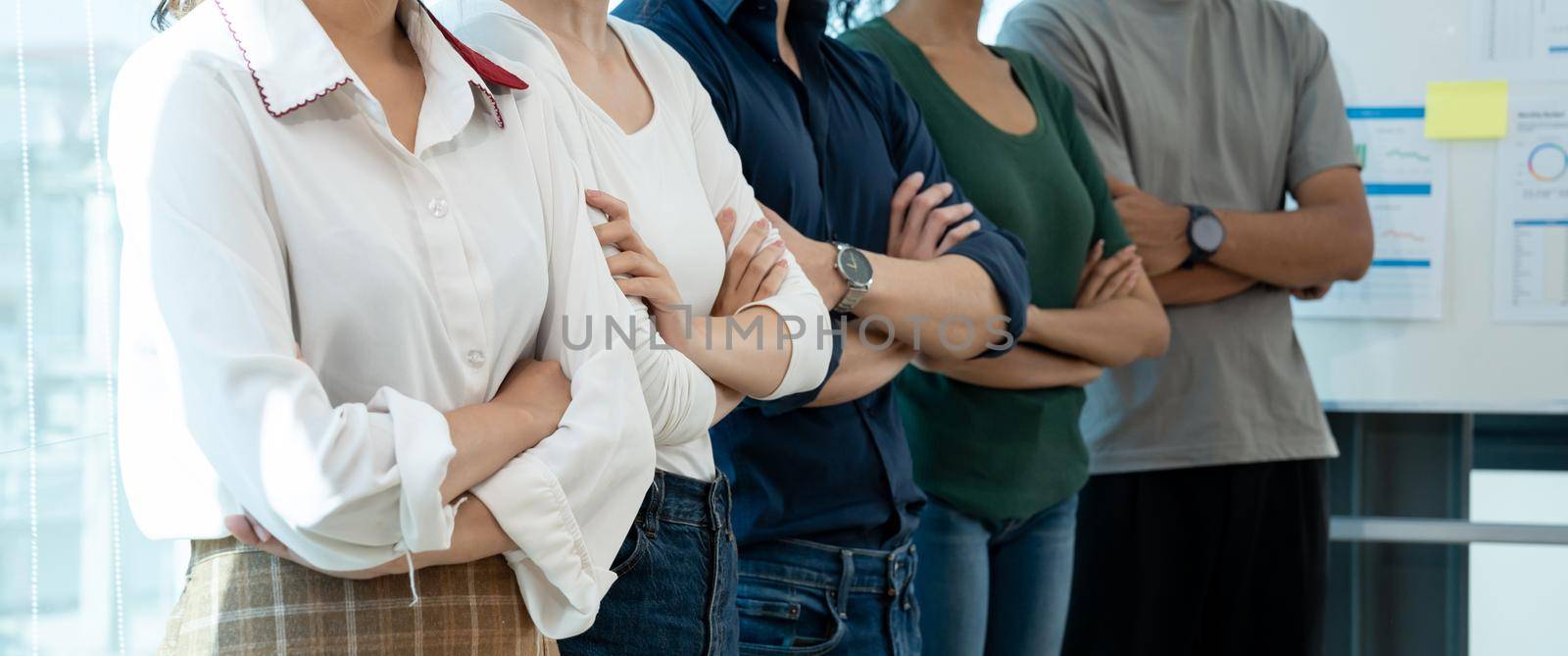 business people in casual standing in row with arms crossed and confident. Company organization employee unity and support. Concept of corporate partnership and human resources growth management