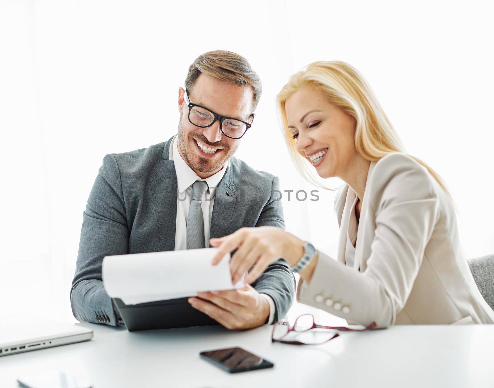 young business people meeting office teamwork paperwork document cotract success corporate discussion by Picsfive