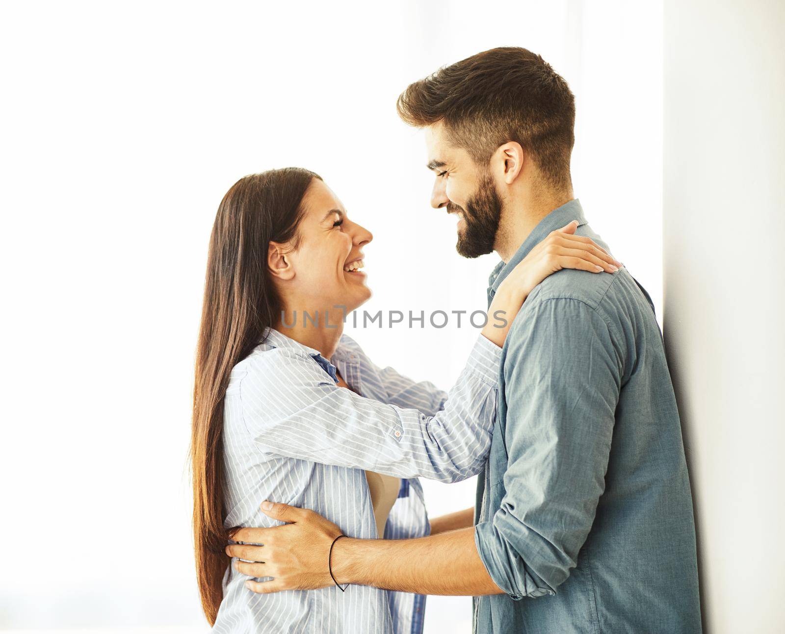 Portrait of a lovely young couple together at home