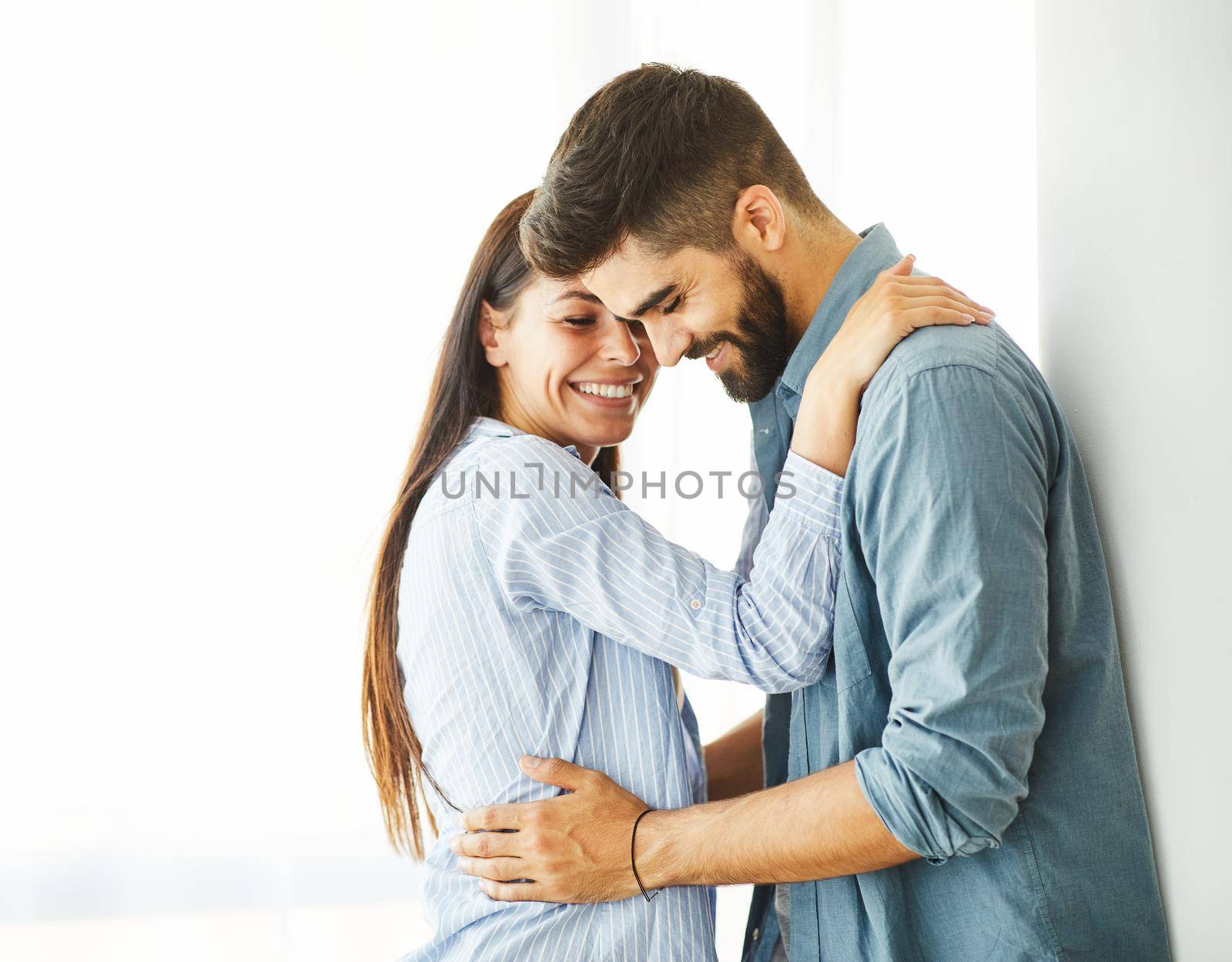 Portrait of a lovely young couple together at home