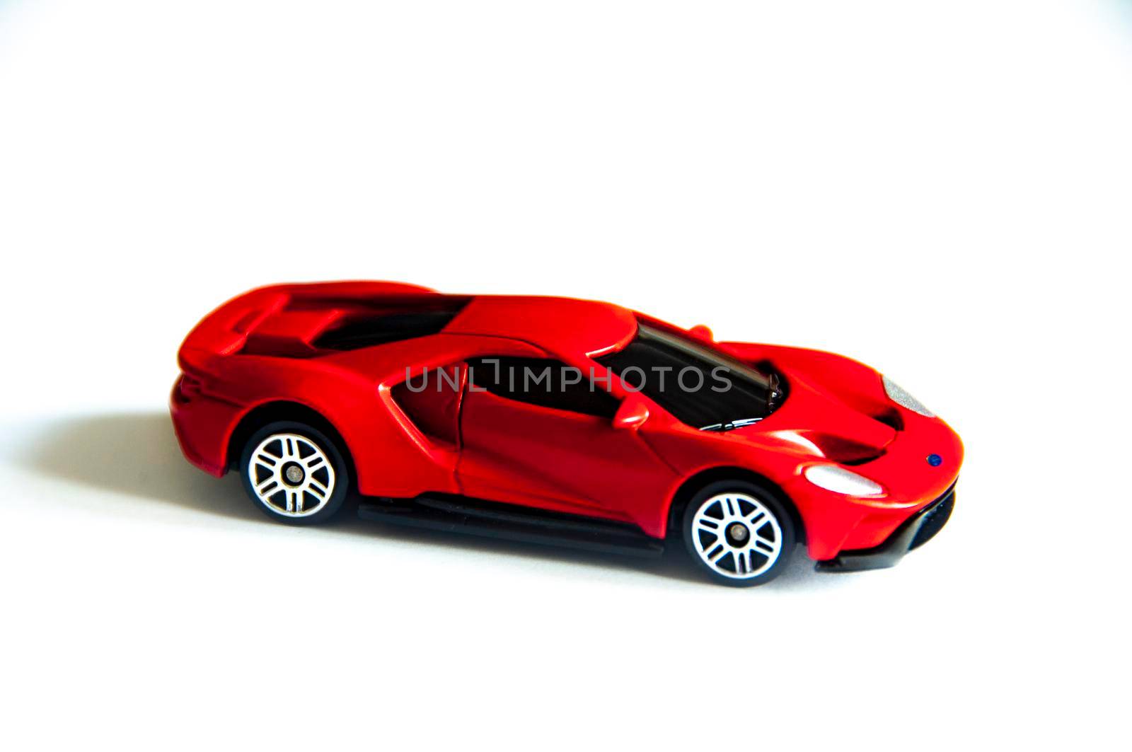 Kuala Lumpur, Malaysia - September 2022 : Selective focus of miniature toy car of Ford GT on white cover background. Copy space.