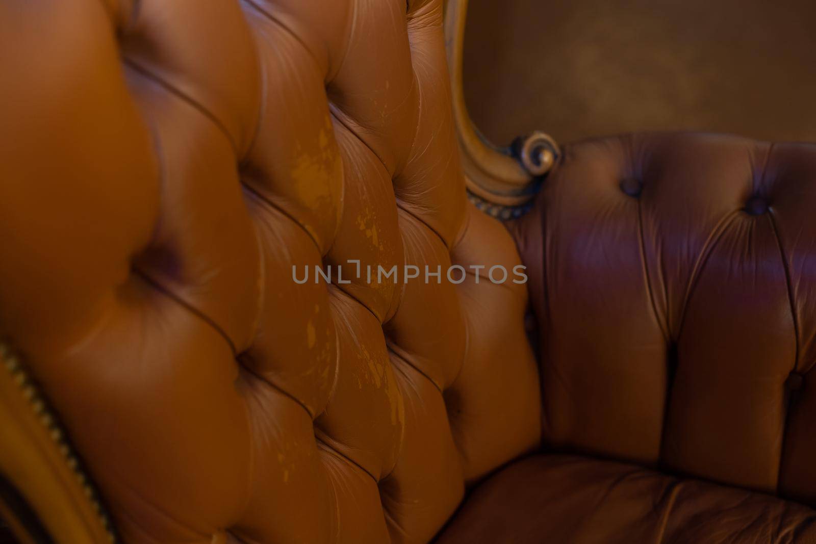 Part of an antique red sofa as a background by Andelov13