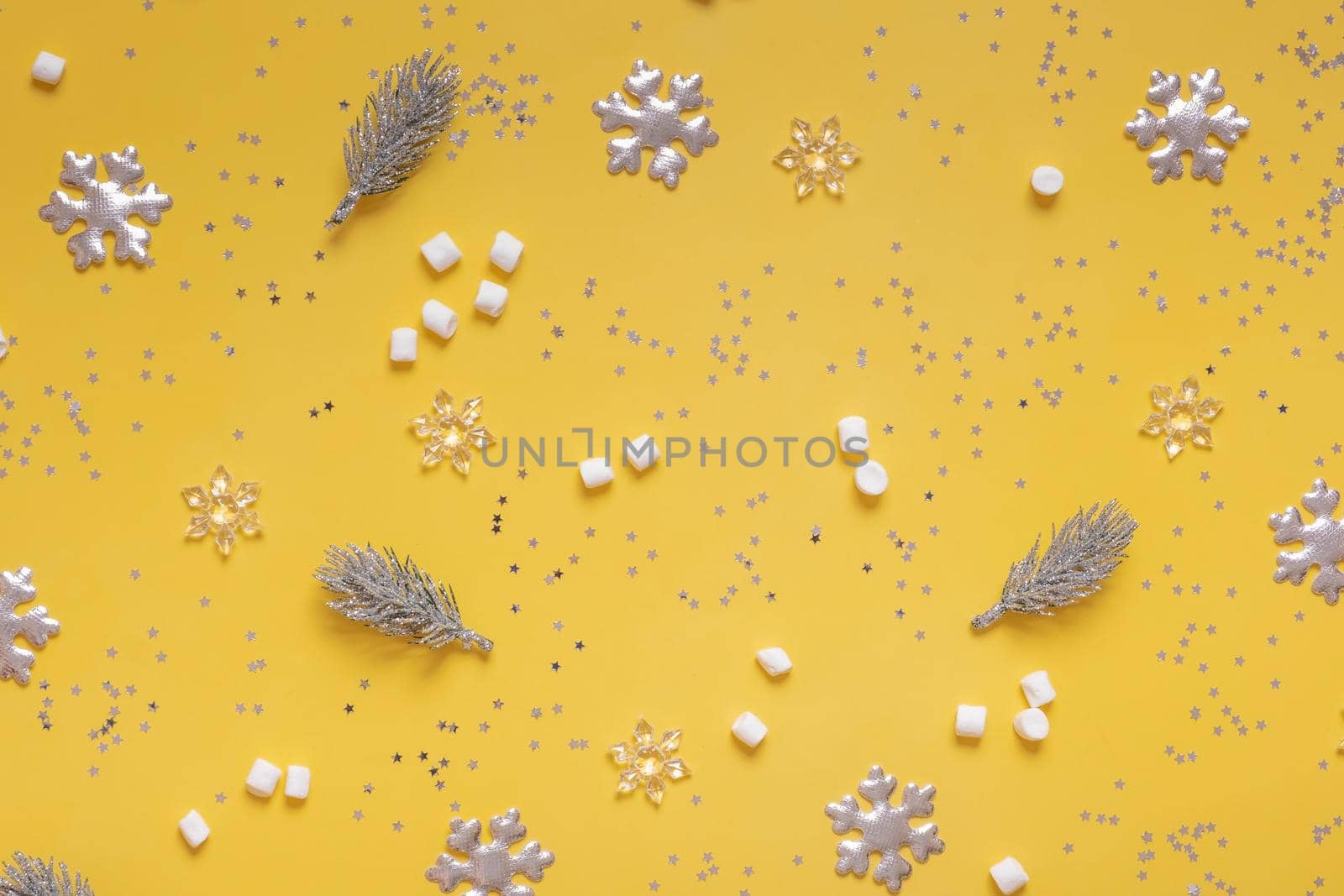 Snowflakes, marsh-mellow and Christmas decorations on colored background top view. Christmas mock up by ssvimaliss
