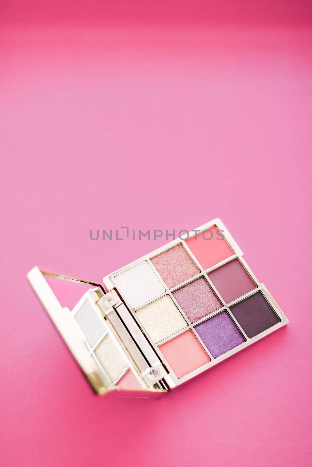 Cosmetic branding, mua and girly concept - Eyeshadow palette and make-up brush on rose background, eye shadows cosmetics product for luxury beauty brand promotion and holiday fashion blog design