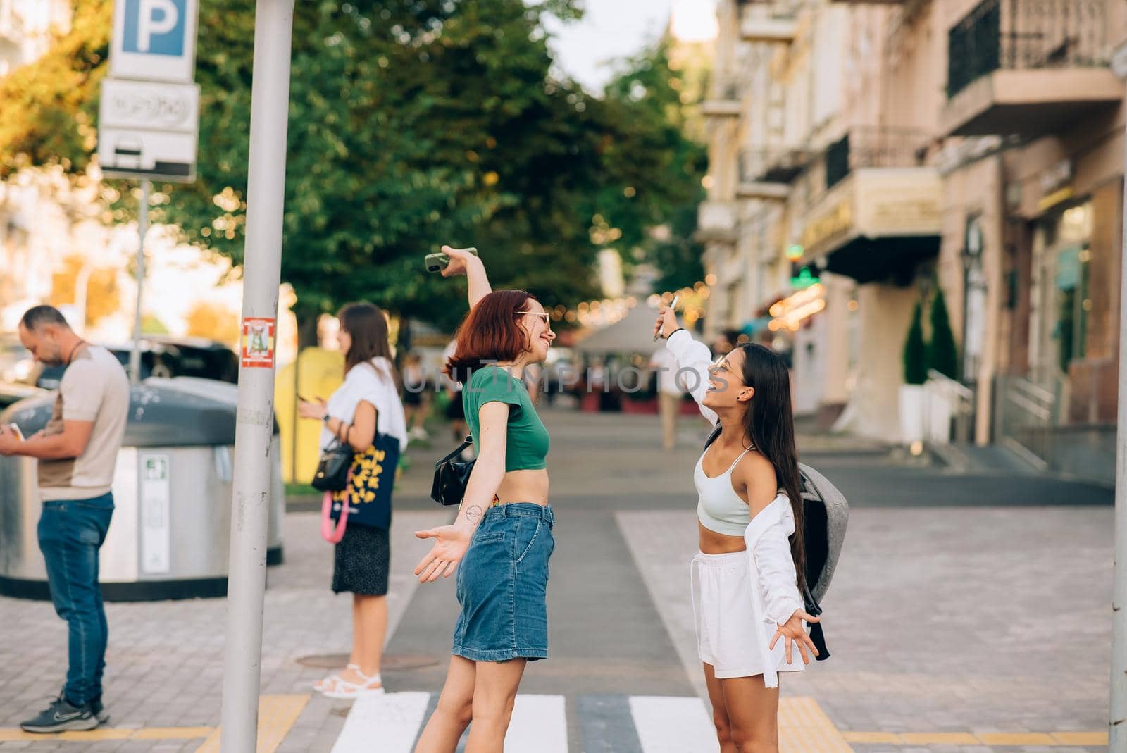 Meeting of two friends hugging in the street