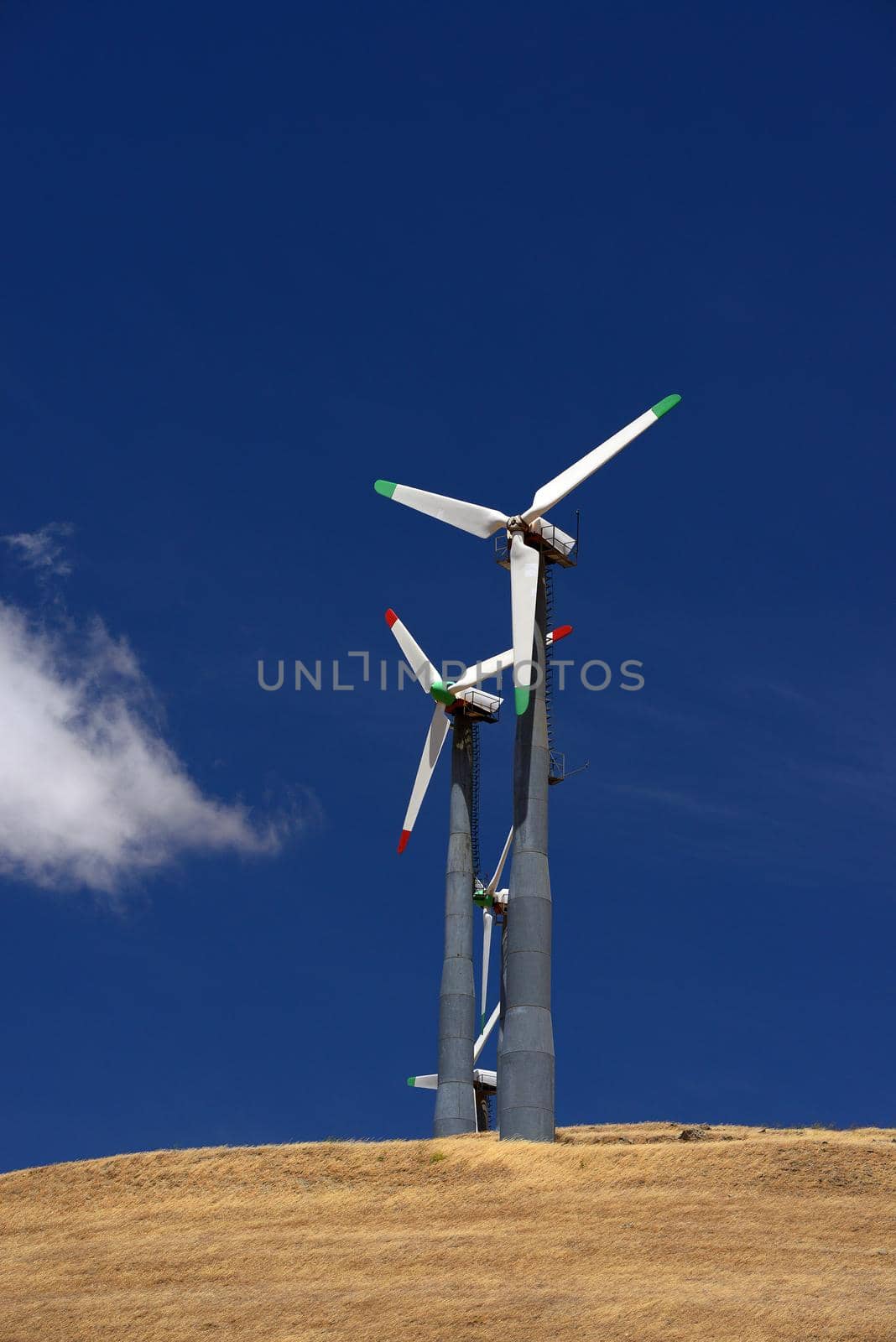 wind turbine power and cloud on grass hill