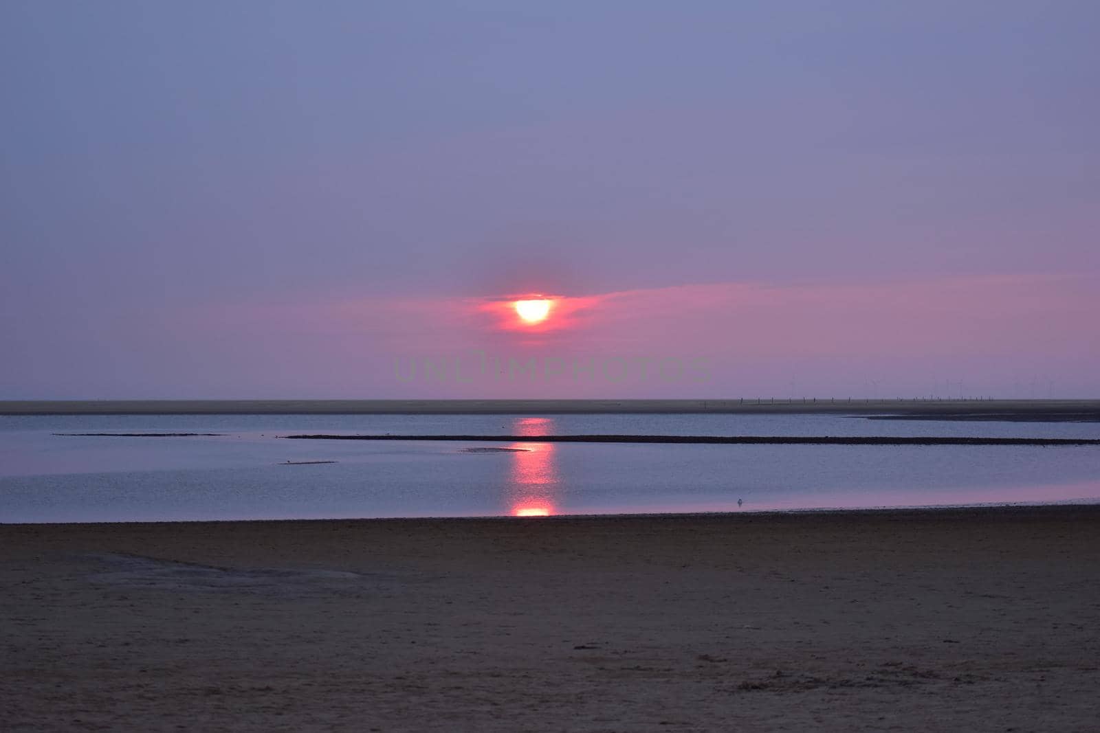 Colorful sunset at a beach at the North Sea by Luise123