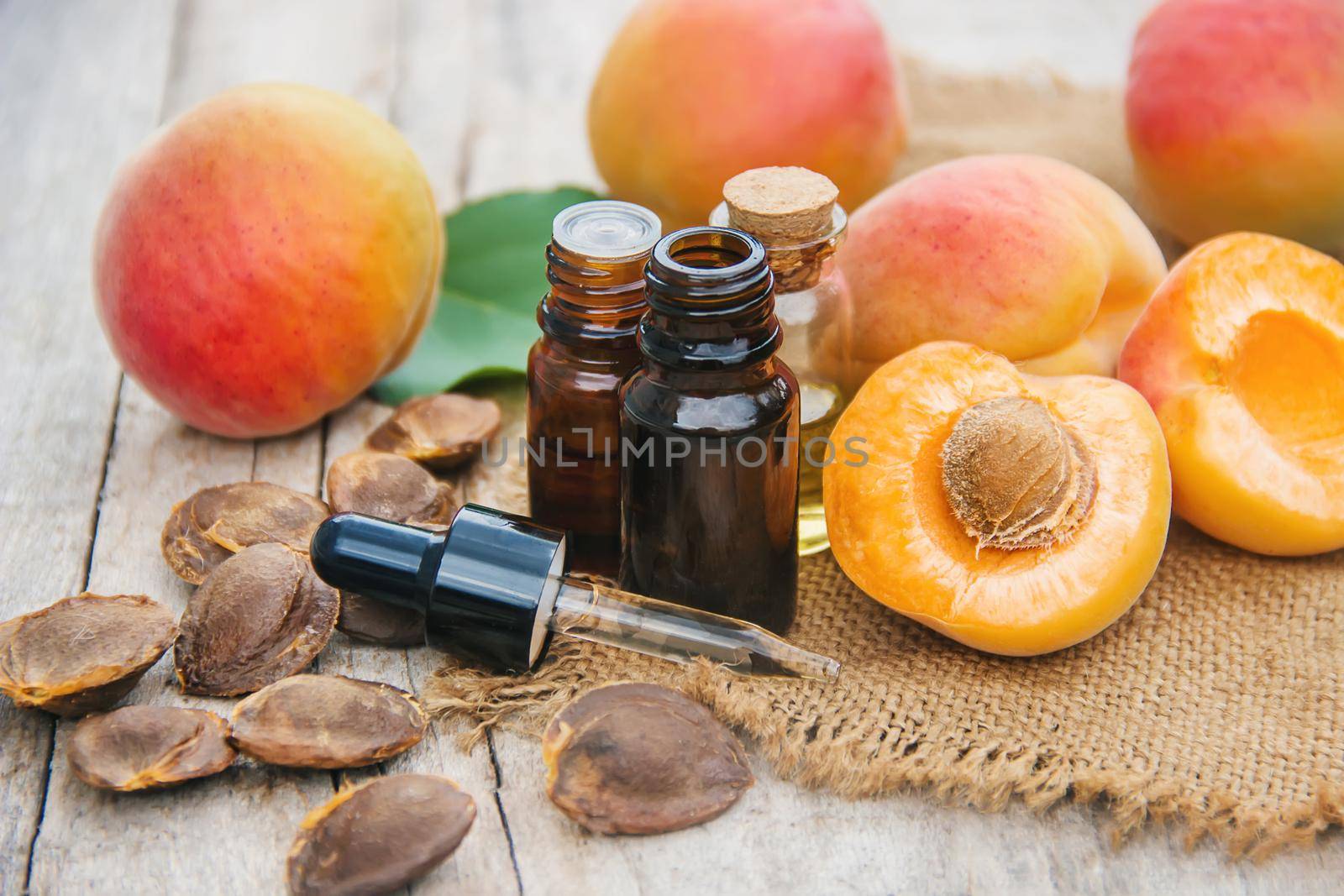 apricot oil in a small jar. selective focus. nature.