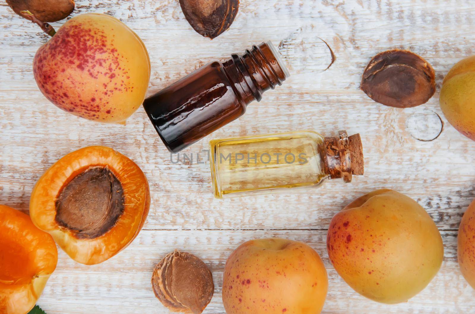 apricot oil in a small jar. selective focus. by yanadjana