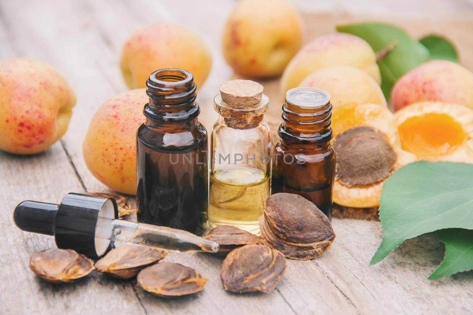 apricot oil in a small jar. selective focus. nature.