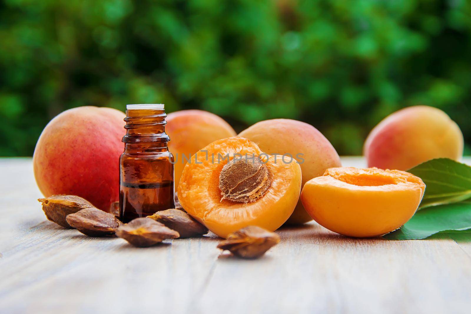 apricot oil in a small jar. selective focus. by yanadjana