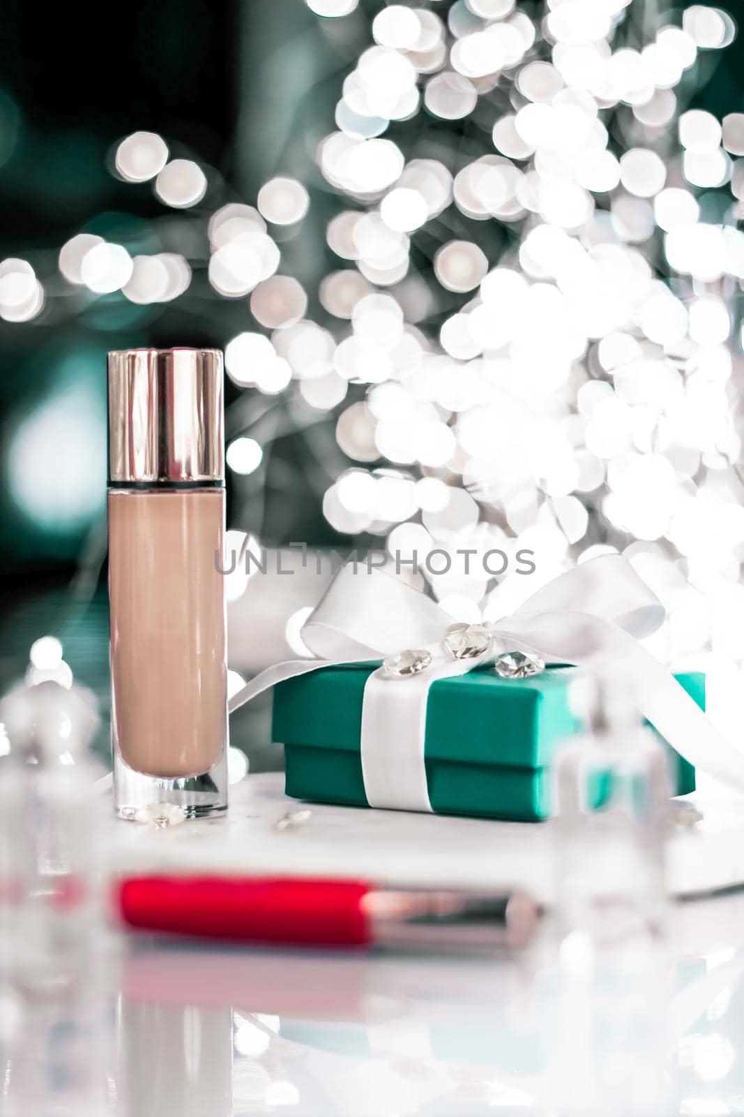 Cosmetic branding, Christmas glitter and girly blog concept - Holiday make-up foundation base, concealer and green gift box, luxury cosmetics present and blank label products for beauty brand design