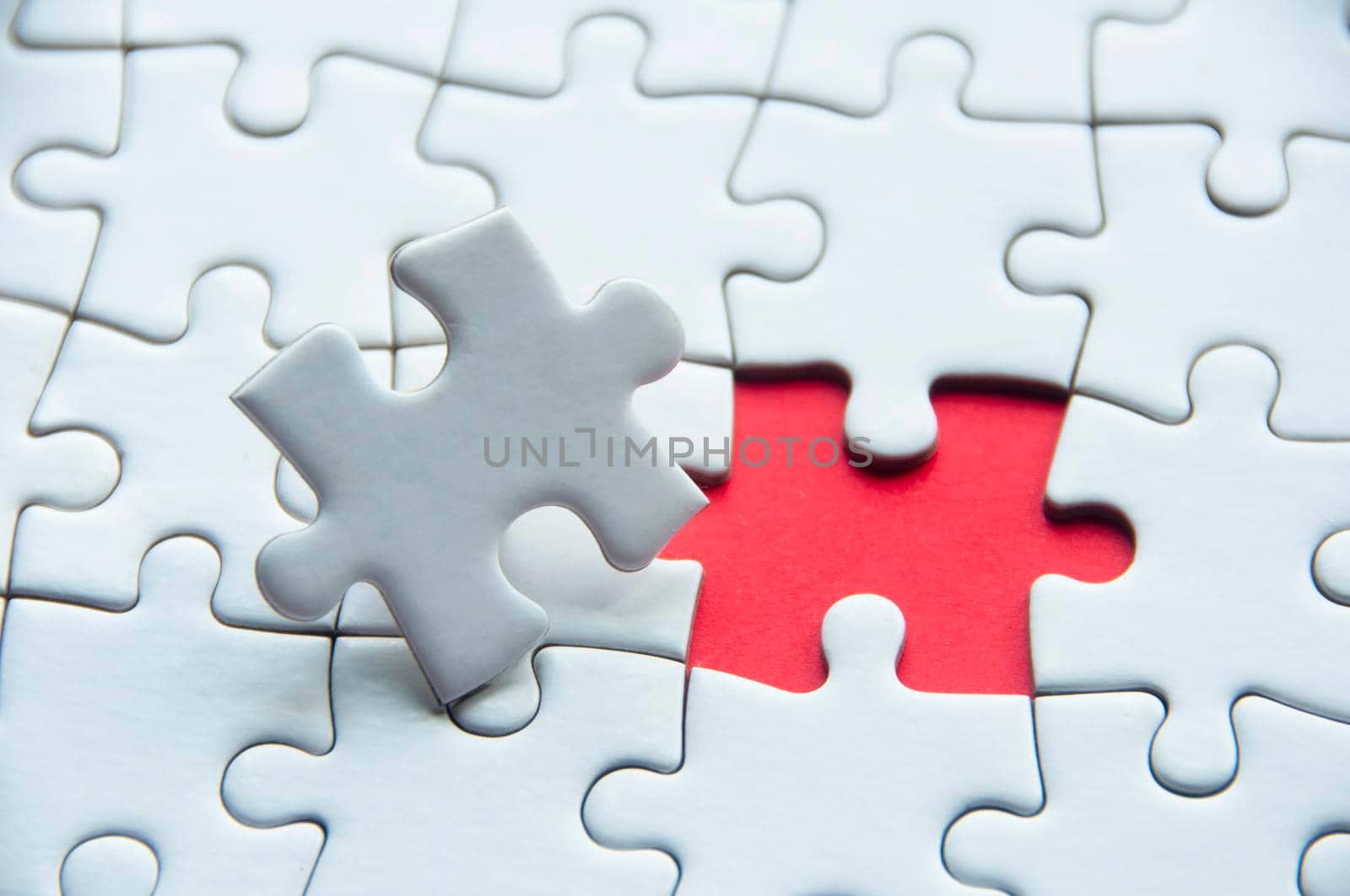 White jigsaw puzzle with customizable space for text or idea. Copy space