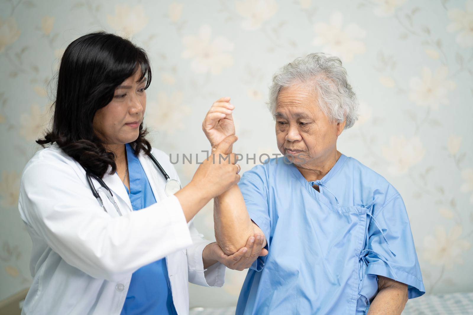 Touching Asian senior or elderly old lady woman patient with love, care, helping, encourage and empathy at nursing hospital ward, healthy strong medical concept by pamai