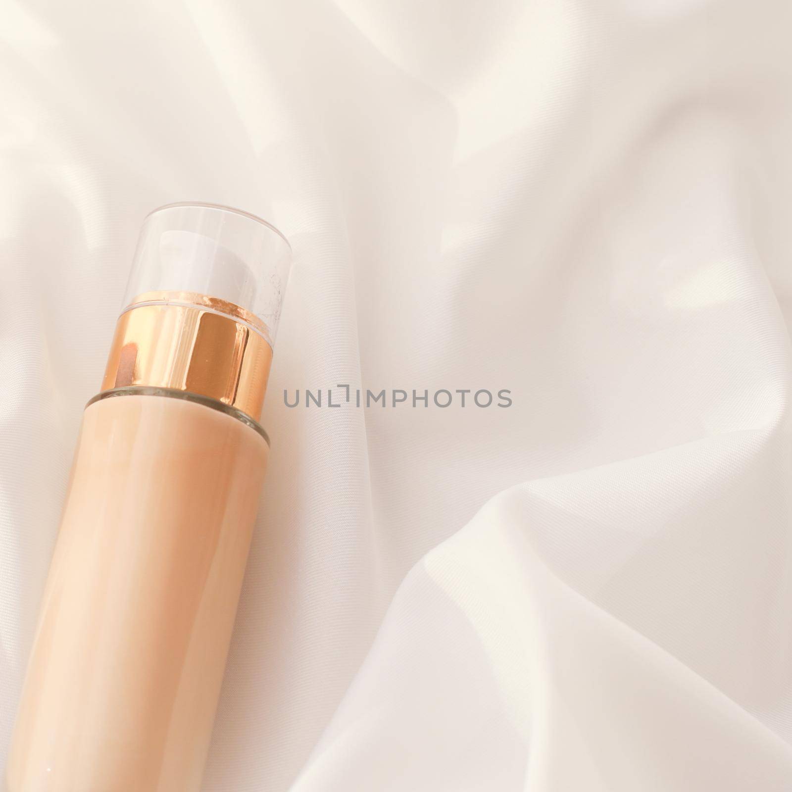 Cosmetic branding, glamour and skincare concept - Tonal bb cream bottle make-up fluid foundation base for nude skin color on silk background, cosmetics product as luxury beauty brand holiday design