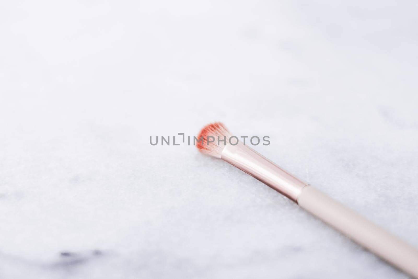 Cosmetic branding, blog and girly concept - Make-up brush for foundation base face contouring on marble background, mua cosmetics as glamour makeup artist product for luxury beauty brand art design