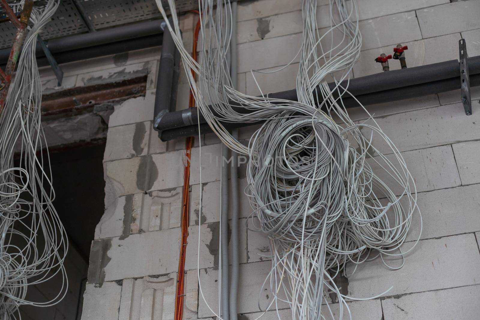 Electrical wiring work at a construction site. Wire extension